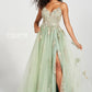 Black curly haired model faced forward wearing ivy prom dress